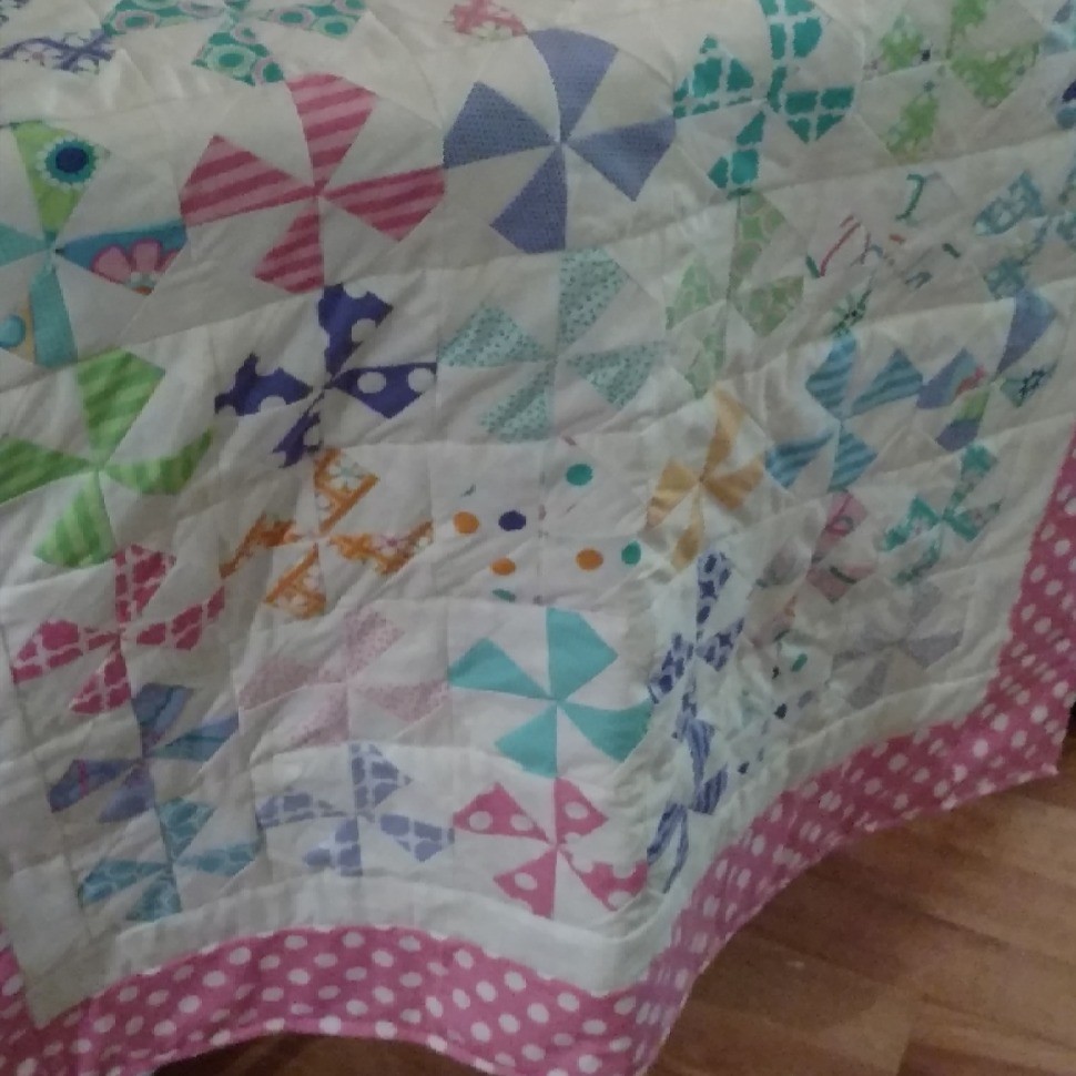 Snowballed pinwheel baby quilt