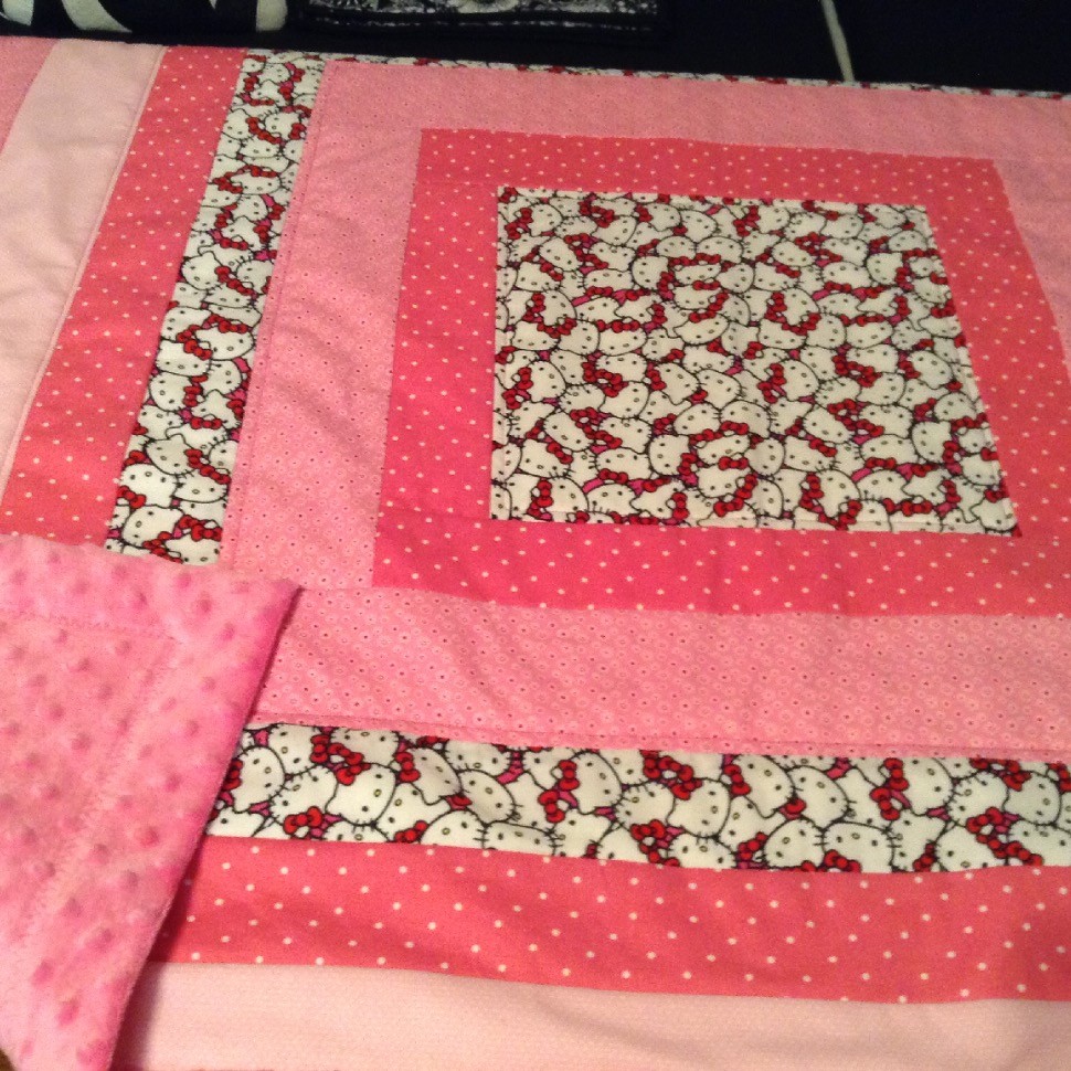 Baby quilt with cuddle fabric backing