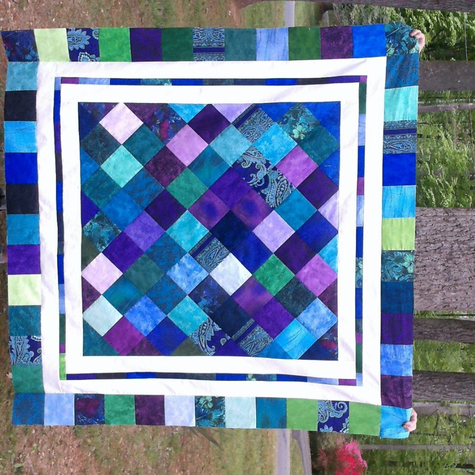 Jewel toned charm quilt on point