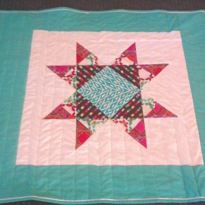 Three Missouri Star baby quilt with flange binding