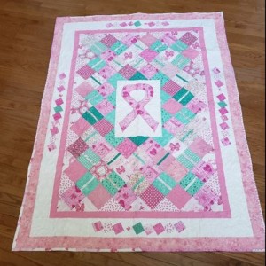 pink and green breast cancer ribbon quilt