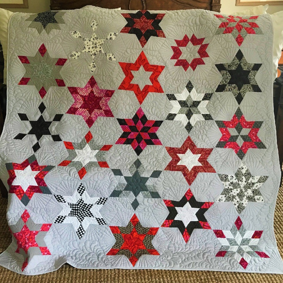 Pink and gray star quilt