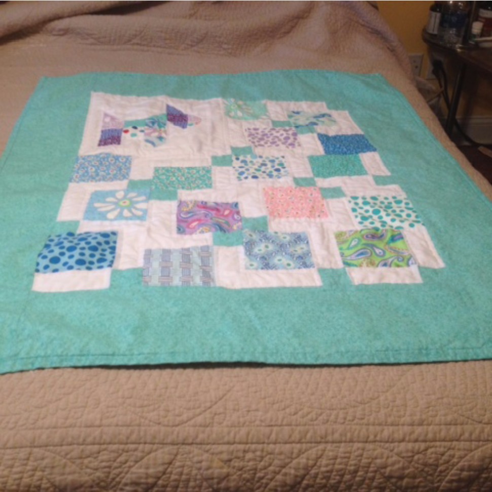 Baby quilt with puppy.
